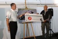 Second placed photographer Friedrich Weisse being presented his prize by Bridgestone Europe South Region MD Andy Davies tb
