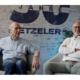 In einer unterhaltsamen Dreiviertelstunde gewähren der ehemalige technische Direktor bei Metzeler Dr. Peter Kronthaler (rechts) sowie Helmut Dähne, ehemaliger Leiter des Renndienstes der Marke, Einblicke in die Motorradreifenentwicklung im Allgemeinen und in die der Null-Grad-Stahlgürteltechnologie im Besonderen (Bild: YouTube/Screenshot)